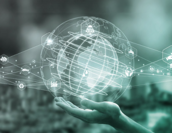 Hand holding a geographic globe